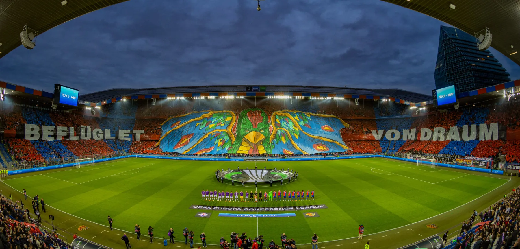 FC Basel supporters displaying a giant phoenix choreography across the stand before a match against Fiorentina